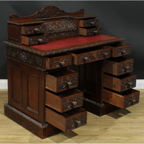 1339 - A late Victorian oak twin pedestal desk, by Edwards & Roberts (fl.1845-1899), stamped, shaped supers... 