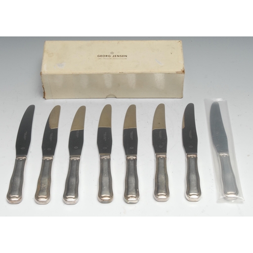 75 - Georg Jensen - a set of eight Danish silver table knives, boxed