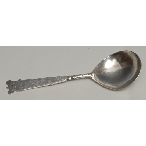 73 - An 18th century Norwegian silver spoon, trefid terminal, the stem engraved with scrolling leaves, pr... 