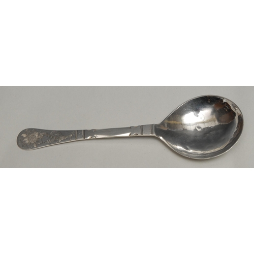 70 - An 18th century Norwegian silver spoon, faceted stem, rounded terminal engraved with a flower, the b... 