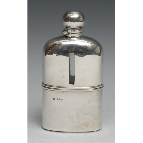 166 - A large Victorian silver hip flask, hinged domed bayonet cover, stirrup cup to base, gilt interior, ... 