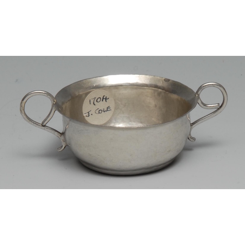 205 - A Queen Anne Britannia silver toy porringer, scroll handles, 7.5cm wide, Lawrence Cole, London 1704