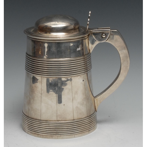 132 - A George III silver spreading cylindrical faux-coopered tankard, hinged domed cover with pierced thu... 