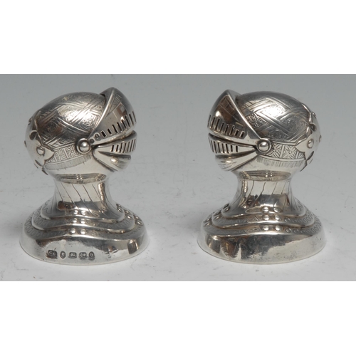 203 - A pair of Victorian silver novelty peppers, as knights, each bust length in a suit of armour, 6.5cm ... 