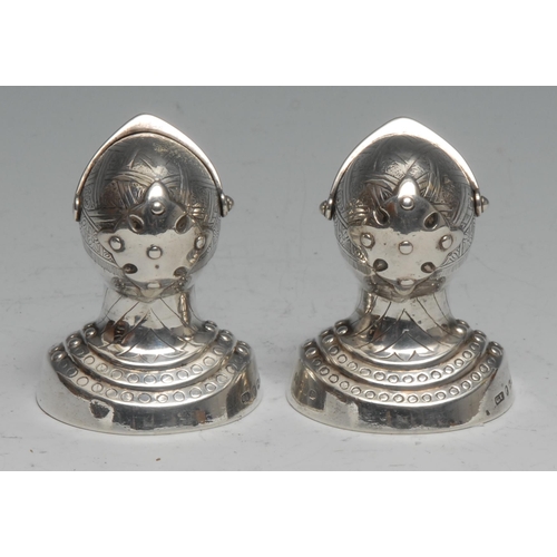 203 - A pair of Victorian silver novelty peppers, as knights, each bust length in a suit of armour, 6.5cm ... 