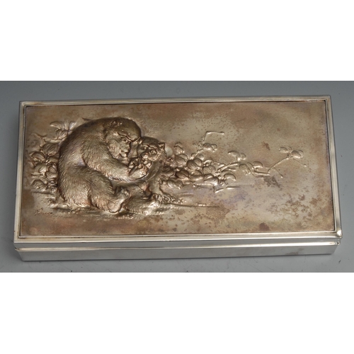 159 - A Japanese silver rectangular cigar box, the matt gilt cover chased with monkeys. hardwood lined, br... 