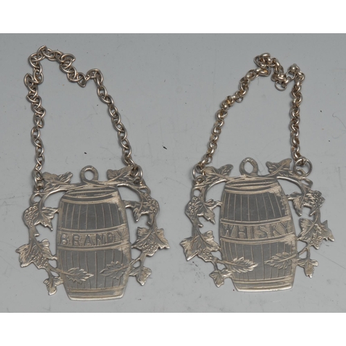 181 - A pair of Elizabeth II silver wine labels, Brandy and Whisky. each as a barrel, 5cm wide, Sheffield ... 