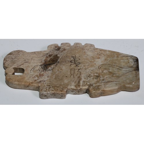 746 - A Chinese Jade archaic type pendant, primitively carved as a mythical beast, 12.4cm wide, 6.5cm high