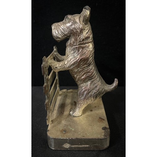 3015 - A pair of chrome plated bookends, cast with Scottish terriers at a fence, 14cm high, c.1930