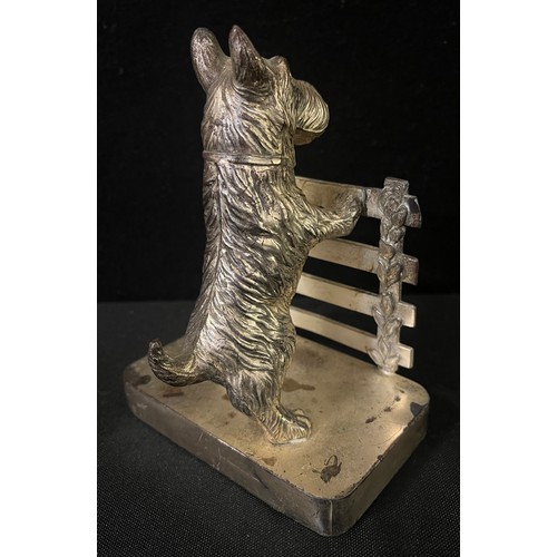 3015 - A pair of chrome plated bookends, cast with Scottish terriers at a fence, 14cm high, c.1930