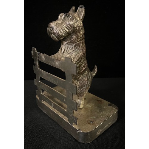 3015 - A pair of chrome plated bookends, cast with Scottish terriers at a fence, 14cm high, c.1930