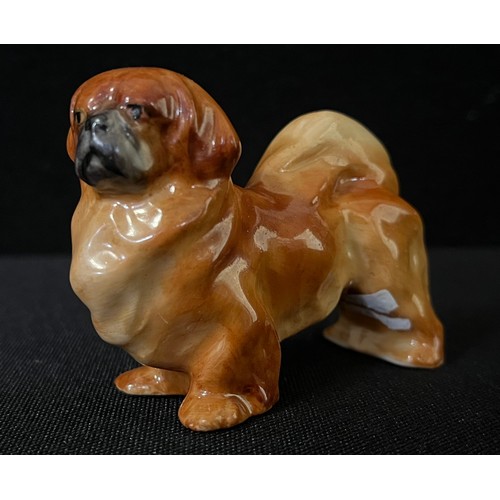 3031 - A Royal Worcester novelty menu holder, as a Pekingese, 2.5cm high, printed mrk in black, model no.29... 