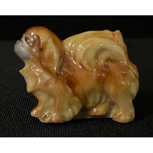 3031 - A Royal Worcester novelty menu holder, as a Pekingese, 2.5cm high, printed mrk in black, model no.29... 