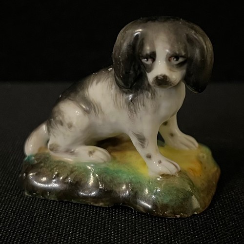 3032 - A mid 19th century Continental  Porcelain model, of a King Charles Spaniel, 4cm high, c.1850;  anoth... 