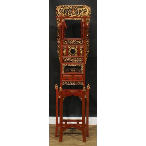 1640 - A Chinese parcel-gilt imitation cinnabar lacquer hall stand, shaped pediment pierced and carved with... 