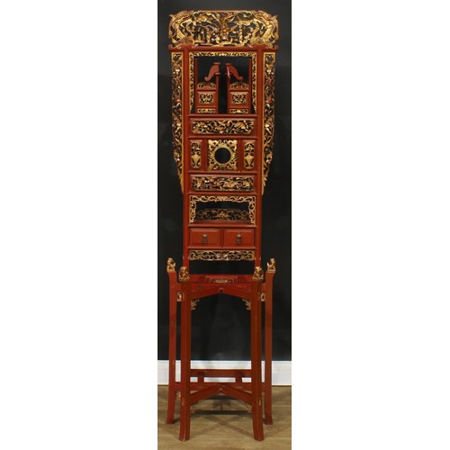 1640 - A Chinese parcel-gilt imitation cinnabar lacquer hall stand, shaped pediment pierced and carved with... 