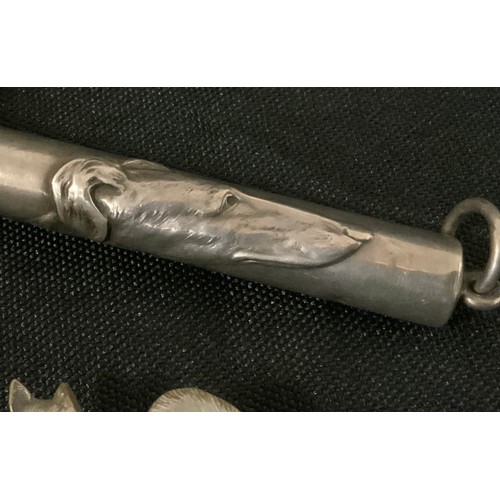 3310 - A silver coloured metal retractable pencil holder, cast with a Greyhounds head, 9.3cm long;  Kernart... 