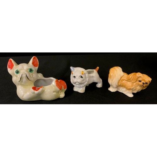 3313 - A Japanese novelty French Bulldog Caricature trinket bowl, 13cm long;  another smaller;  Pekinese fi... 