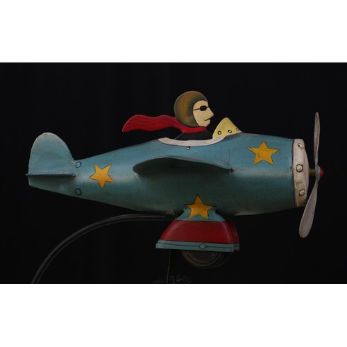 2197 - Folk Art - a novelty weighted balance toy, in the form of a Flying Ace, the seated pilot figure with... 