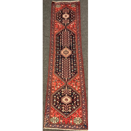 22 - A South-west Persian hand-knotted Abadeh runner carpet, 295cm x 75cm.