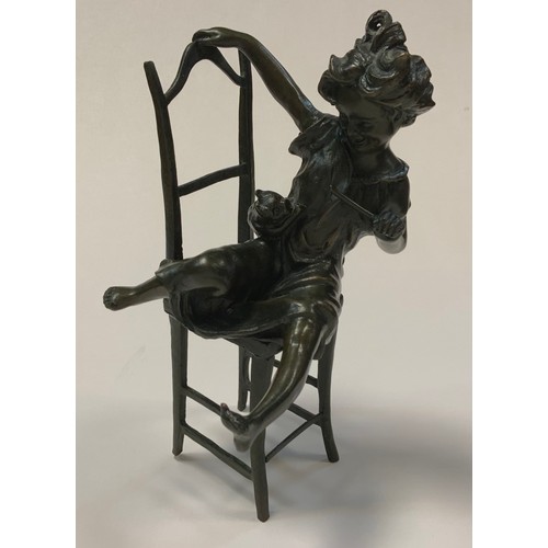 23 - Juan Clara (Spanish, 1875-1958), after, a patinated bronze figure of a young playful girl with kitte... 