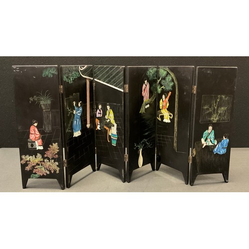 32 - A Japanese lacquered six panel table screen, scribes and minstrels in contemplation, the reverse, mo... 