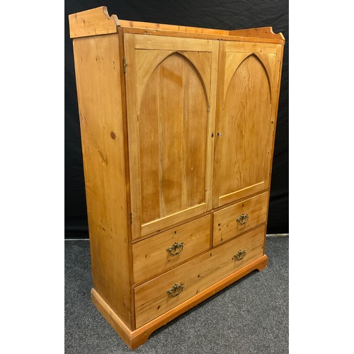 35 - An early 20th century pine hall robe, three quarter galleried top, pair of arch-panel cupboard doors... 