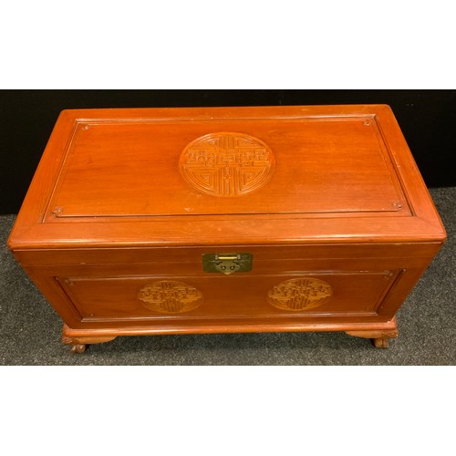 41 - A Chinese camphor wood chest/blanket box, rounded carved detailing to top and frieze, dragon mask ca... 