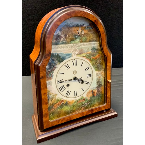 67 - A German mantel clock, arched case, the dial decorated with Hounds, Ducks, Fox, Pheasants etc, mecha... 