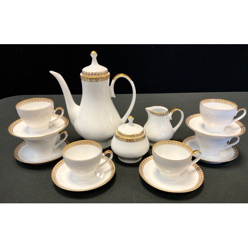 73 - A German Kahla Konitz demitasse coffee set, for six , gilt floral decoration, printed marks