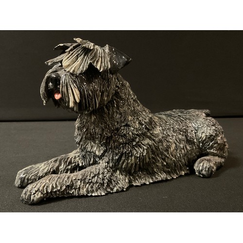 87 - An Eve Pearce model of Schnauzer reclining, 20cm long, painted initials