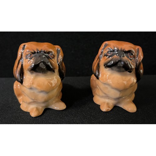 89 - A Royal Doulton model of a Pekingese, 5cm high, printed mark;  another;  a Crown Devon Pekingese wal... 