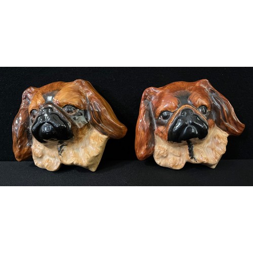 89 - A Royal Doulton model of a Pekingese, 5cm high, printed mark;  another;  a Crown Devon Pekingese wal... 