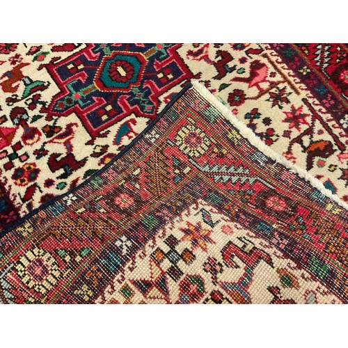 117 - A North-west Persian hand-knotted Heriz Runner carpet / rug, 388cm x 79cm.