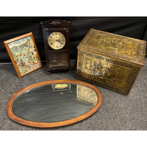 166 - A wood and brass panelled lidded box, decorated with scrolls in a border centred with a hunting scen... 