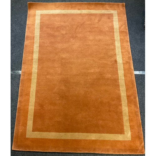 168 - A modern design woollen rug / carpet, with alternating bands in red, orange green and cream, 180cm x... 