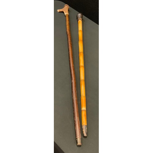 201 - A Victorian bone walking stick, turned pommel, 83cm long, c.1890;  another, horn handle, with whistl... 