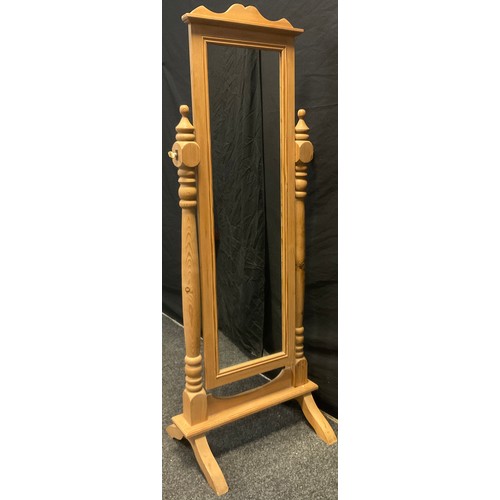 178 - A pine cheval mirror, turned columns, splayed feet, 160cm high, 60cm wide