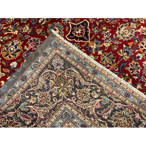 239 - A Central Persian Kashan carpet / rug, the central Navette-shaped medallion within a field of scroll... 