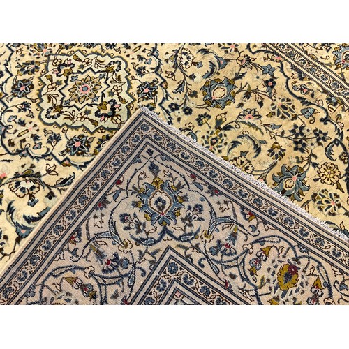 242 - A Persian Kashan carpet, the central diamond-shaped medallion within a field of stylised flowers, si... 