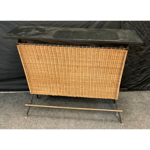 243 - A retro wicker and teak bar, black top, wicker front, two shelf interior, tubular metal frame, 104cm... 