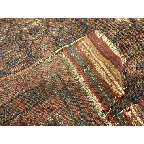 251 - A Persian Baluch style woollen prayer rug, 132cm x 90cm;  another, Persian woollen rug, central pane... 