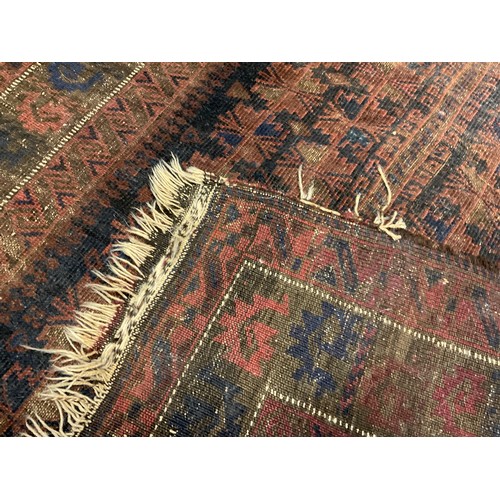 251 - A Persian Baluch style woollen prayer rug, 132cm x 90cm;  another, Persian woollen rug, central pane... 