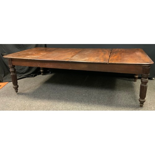 236 - A 19th century mahogany dining table, rounded rectangular four section top, turned reeded supports, ... 