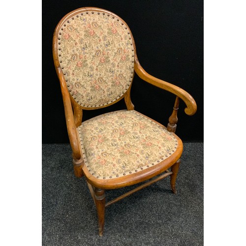 269 - A 19th century beech armchair, floral upholstered back and seat, scrolling arms, turned supports and... 