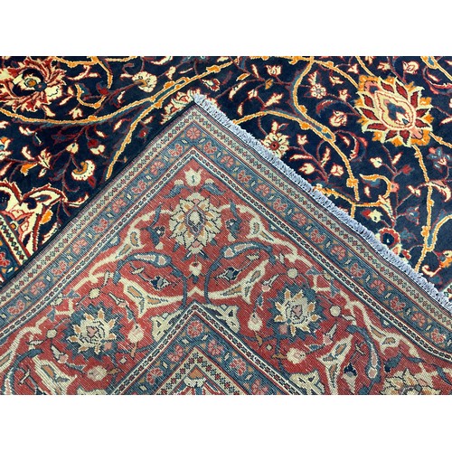 298 - A Persian Kashan carpet, the diamond-shaped medallion within a field of scrolling flowering stems, i... 