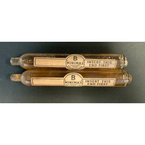 319 - Two early 20th century fire grenades canisters, the label inscribed  Sulphuric Acid, Poison, Not to ... 