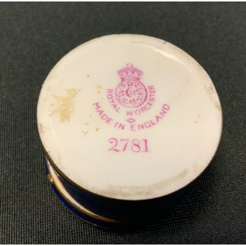 312 - A Royal Worcester cylindrical box, the cover painted by Rushton, signed with castle, lake and figure... 