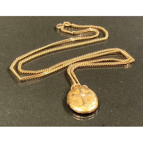 458 - A late Victorian gold coloured metal oval photograph locket, suspended from a 9ct gold chain, 12.5 g... 