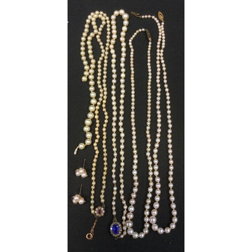 433 - A graduated cultured pearl necklace, 9ct gold clasp;  other unmarked;  a pair of similar earrings, y... 